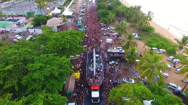 Aerial view of brazillian carnival in Porto Seguro beach, Bahia, Brazil. Great street carnival scene. Travel destination. Carnaporto, Axe Moi festival, music fest.