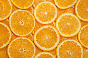 Fresh orange slices as background, top view