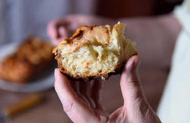Slice of freshly baked apple pie in hand