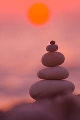 stack of zen stones on pebble beach