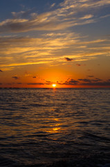 Amazing sea sunset, the sun, waves, clouds