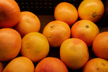Grapefruit in a basket on the counter of a vegetable store
