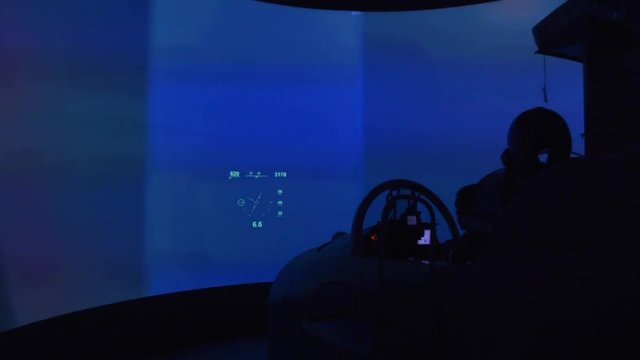 Pilot seats in fighter jet cockpit flight simulator