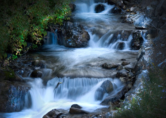 Fototapeta na wymiar waterfall, cascade, mountain waterfall, water, stream, moving, blurred water, movement, nature