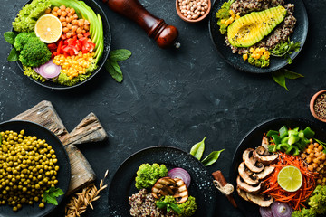 A set of healthy food on a black stone table. Bowl Buddha. Top view. Free space for your text.