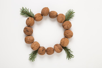 Wallnuts arranged in a circle as round decorative wreath