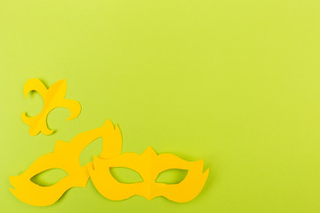 cut out colored paper figures for the holiday Mardi Gras