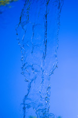 transparent falling water vertical flows, close up