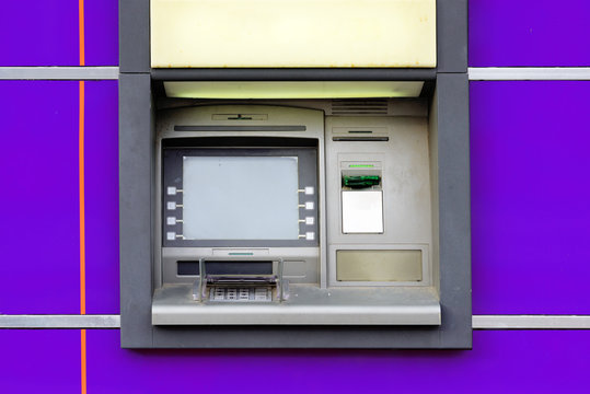 Old dirty ATM on street