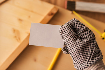 Carpenter holding blank mock up business card