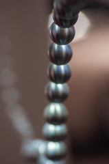 metal balls on string