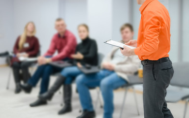 Lecturer conducts a lecture, training.