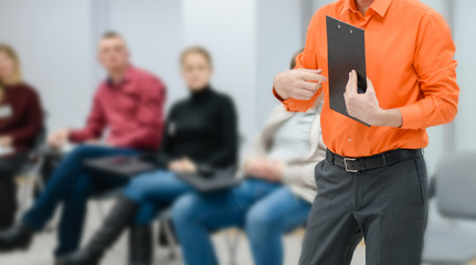 Lecturer conducts a lecture, training.