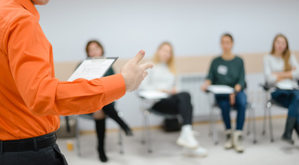 Lecturer conducts a lecture, training.