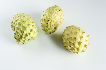 Annona, Custard Apple, Cherimoya, Sugar Apple on White Desk Background.Annona muricata and other plants have been shown to have promising compounds that can be utilised in the treatment of cancer.