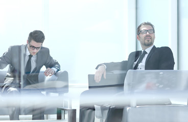 business partners sitting in a modern office