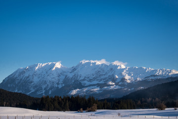 Snowy mountains Grimming, Schartenspitze, Steinfeldspitze on a sunny winter day