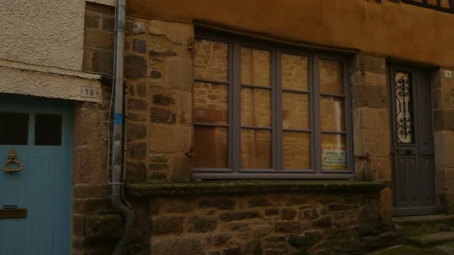 DINAN, FRANCE - APRIL 06, 2018: view of empty beautiful street with old traditional houses at the center of Dinan, Brittany, France
