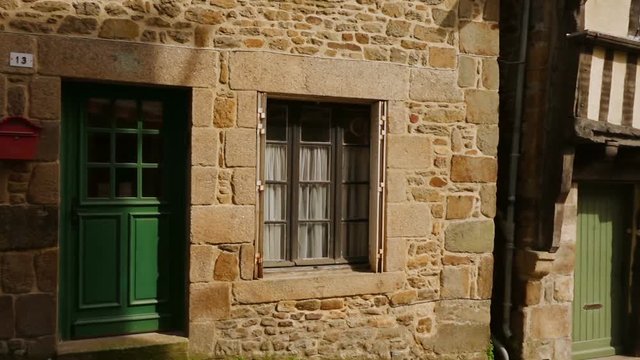 DINAN, FRANCE - APRIL 06, 2018: view of empty beautiful street with old traditional houses at the center of Dinan, Brittany, France