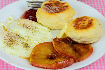 Candied Apples on Breakfast Plate with Eggs and Biscuits