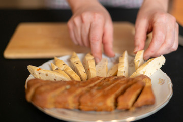 housekeeper puts bread on a plate