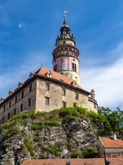 Fototapeta na wymiar View of the Unesco World Heritage City Cesky Krumlov in the Czech Republic with historic buildings, churches and narrow streets in front of blue sky