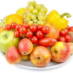 Fruits and vegetables on a platter isolated on white background.