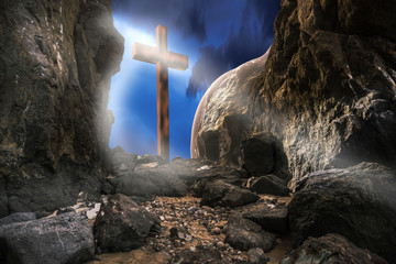 Resurrection of Jesus Christ. Empty tomb with cross against the sky. Christian religion.