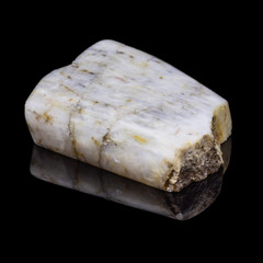 Natural piece of belomorite on black background