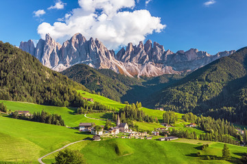 Famous alpine place  Santa Maddalena village with magical Dolomites mountains in background, Val di Funes valley, Trentino Alto Adige region, Italy, Europe