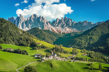 Famous alpine place  Santa Maddalena village with magical Dolomites mountains in background, Val di Funes valley, Trentino Alto Adige region, Italy, Europe