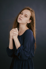 Fototapeta premium Portrait of a girl in a blue blouse