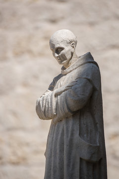 Illuminated monk statue in Cartuja monastery, Burgos, Spain