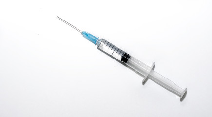 Syringe with injection on white background