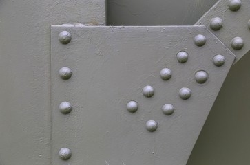 Structural steel plate fastened with solid type rivets