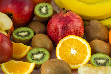 Naklejka na ściany i meble Tropical fruits on a white background, juicy still-life from fruit. Useful fruit for a healthy diet. Mix of different fruits.