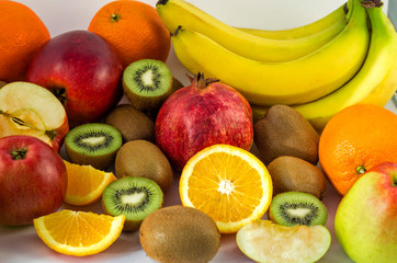 Tropical fruits on a white background, juicy still-life from fruit. Useful fruit for a healthy diet. Mix of different fruits.