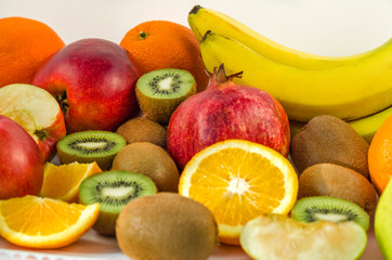 Tropical fruits on a white background, juicy still-life from fruit. Useful fruit for a healthy diet. Mix of different fruits.