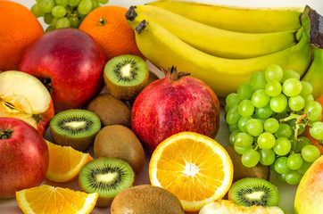 Tropical fruits on a white background, juicy still-life from fruit. Useful fruit for a healthy diet. Mix of different fruits.