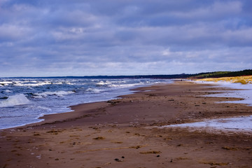 frozen ice blocks on sea beach in winter