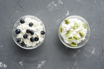 cottage cheese for breakfast in bowls on grey background