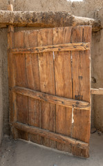 Rustic gate made of untreated wood with characteristic grain