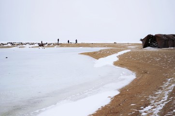 Fototapeta na wymiar Sea in the winter. Ice at the sea.