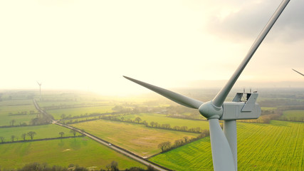 Aerial photo of wind turbines at sunset in Sainte Pazanne, France - Powered by Adobe