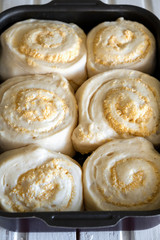 Sweet buns with filling in a square shape for baking.