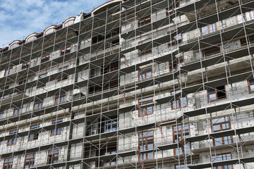 new building under construction, scaffolding and concrete
