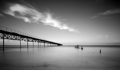 Fototapeta premium Long exposure shot of the sea and a pier in Ukraine.