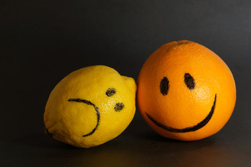emotions abstract sad lemon and cheerful orange design concept  optimism and pessimism