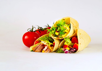 Traditional dish of Mexican cuisine. Corn tortilla tacos with vegetable filling on isolated white background. 