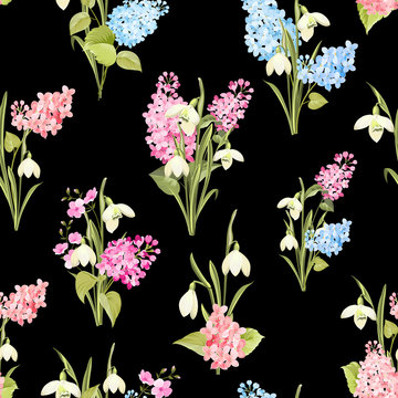 Seamless pattern of siringa and galantus flowers for fabric pattern over black background. Vector illustration.